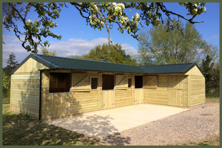 4 stable L-Shape L-shaped timber stable with four stable boxes and steel box profile roof