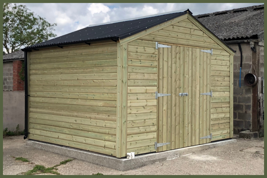 High-quality timber garden storage shed with solid wooden cladding, secure double doors, and a weatherproof roof, ideal for outdoor equipment and tools