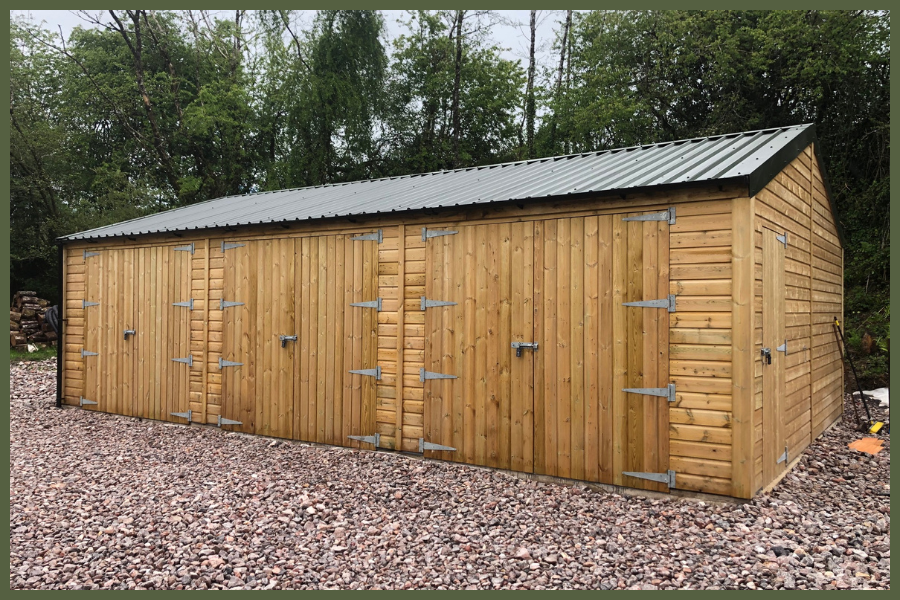High-quality timber garden storage shed with solid wooden cladding, secure double doors, and a weatherproof roof, ideal for outdoor equipment and tools.
